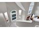 Well-lit staircase features wall niches for displaying decor and natural light at 103 Uxbridge Ct, Cary, NC 27513