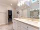 This bathroom features a double sink vanity, and large mirrors and a glass shower at 104 Deer Park Ln, Cary, NC 27518