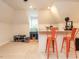 This bonus room offers a bar seating area, natural light, and neutral carpet at 104 Deer Park Ln, Cary, NC 27518