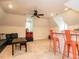 This bonus room offers a ceiling fan, neutral carpet, and a bar seating area at 104 Deer Park Ln, Cary, NC 27518