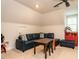 This bonus room offers a ceiling fan, natural light, and a seating area at 104 Deer Park Ln, Cary, NC 27518