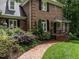 Beautiful brick home exterior with manicured landscaping and welcoming entrance at 104 Deer Park Ln, Cary, NC 27518