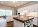 Gourmet kitchen with custom cabinetry, an island, granite countertops and modern stainless steel appliances at 104 Deer Park Ln, Cary, NC 27518