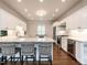 Beautiful kitchen with white cabinets, granite countertops, and stainless steel appliances at 104 Deer Park Ln, Cary, NC 27518