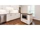 Updated kitchen with white cabinets, modern stainless steel appliances, and island with wooden countertop at 104 Deer Park Ln, Cary, NC 27518