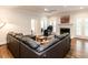 Cozy living room with a fireplace, plush seating, and lots of natural light at 104 Deer Park Ln, Cary, NC 27518