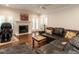 Inviting living room featuring a fireplace, hardwood floors, and windows at 104 Deer Park Ln, Cary, NC 27518