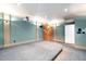 Finished basement featuring projector, custom lighting, and a raised platform, perfect for a home theater at 10405 Veasey Mill Rd, Raleigh, NC 27615