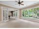 Large bonus room with French doors, views, and access to the outdoors at 10405 Veasey Mill Rd, Raleigh, NC 27615
