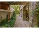 Charming home exterior with stone accents and lush landscaping, featuring a covered walkway at 10405 Veasey Mill Rd, Raleigh, NC 27615