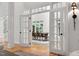 Foyer with hardwood floors and french doors leading into bright open living space at 10405 Veasey Mill Rd, Raleigh, NC 27615