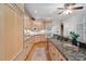 Kitchen featuring granite countertops, custom cabinetry, hardwood floors and stainless appliances at 10405 Veasey Mill Rd, Raleigh, NC 27615