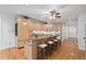 Kitchen with granite counters, center island with seating, and stainless steel appliances at 10405 Veasey Mill Rd, Raleigh, NC 27615