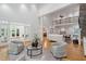 Open-concept living room with high ceilings, hardwood floors and lots of natural light at 10405 Veasey Mill Rd, Raleigh, NC 27615