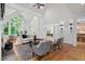 Bright living room with vaulted ceilings, arched windows, hardwood floors and fireplace at 10405 Veasey Mill Rd, Raleigh, NC 27615