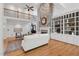 Living room featuring stone fireplace, hardwood floors, and open-concept layout at 10405 Veasey Mill Rd, Raleigh, NC 27615