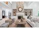 Bright living room features stone fireplace, built-in shelves, and soaring ceilings at 10405 Veasey Mill Rd, Raleigh, NC 27615