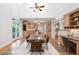 Open concept living space with built-in office, dining area, kitchen, and backyard access at 10405 Veasey Mill Rd, Raleigh, NC 27615