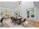 Bright living space with vaulted ceiling, hardwood floors, dining and backyard access at 10405 Veasey Mill Rd, Raleigh, NC 27615
