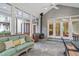 Relaxing screened porch with slate flooring, fireplace, seating, and peaceful wooded views at 10405 Veasey Mill Rd, Raleigh, NC 27615