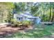 A charming one story home featuring a deck and landscaping at 10816 Bent Branch Dr, Raleigh, NC 27603