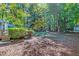 Spacious backyard with deck and mature trees at 10816 Bent Branch Dr, Raleigh, NC 27603
