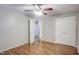 Cozy bedroom with hardwood floors, ceiling fan, and double closet at 10816 Bent Branch Dr, Raleigh, NC 27603