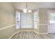 Bright dining area with triple windows and white trim next to the backyard entrance at 10816 Bent Branch Dr, Raleigh, NC 27603