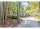 Charming home with lush tree lined gravel driveway at 10816 Bent Branch Dr, Raleigh, NC 27603