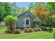Beautiful home with bay window, lush landscaping, and vibrant green lawn at 10816 Bent Branch Dr, Raleigh, NC 27603