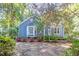 Charming home surrounded by mature plants and foliage at 10816 Bent Branch Dr, Raleigh, NC 27603