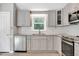 Modern kitchen with stainless steel appliances, granite countertops and ample cabinet space at 10816 Bent Branch Dr, Raleigh, NC 27603