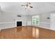 Spacious living room with hardwood floors, fireplace and built-in shelving, perfect for entertaining at 10816 Bent Branch Dr, Raleigh, NC 27603