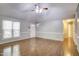 Spacious living room featuring hardwood floors, a ceiling fan, and neutral wall paint at 10816 Bent Branch Dr, Raleigh, NC 27603