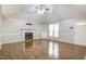 Bright living room with hardwood floors, fireplace, built-in shelving and recessed lighting at 10816 Bent Branch Dr, Raleigh, NC 27603