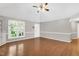 Open living room featuring hardwood floors, vaulted ceiling and plenty of natural light at 10816 Bent Branch Dr, Raleigh, NC 27603
