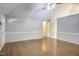 Open living room with hardwood floors and neutral wall paint at 10816 Bent Branch Dr, Raleigh, NC 27603