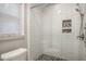 Modern bathroom with white subway tile shower, glass door, and mosaic tile flooring at 10816 Bent Branch Dr, Raleigh, NC 27603
