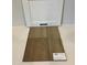 Close up showcasing white countertops and driftwood vinyl flooring options at 110 Cordoba Dr, Franklinton, NC 27525