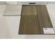 Close up showcasing stone countertops and driftwood vinyl flooring options at 110 Cordoba Dr, Franklinton, NC 27525