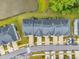 An aerial view showcases a community of townhomes and a pond surrounded by lush greenery at 1156 Craigmeade Dr, Morrisville, NC 27560