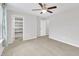 Empty bedroom featuring a ceiling fan, carpet and access to a walk-in closet at 1156 Craigmeade Dr, Morrisville, NC 27560