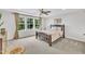 Inviting bedroom with large windows, neutral decor, and a comfortable bed at 1156 Craigmeade Dr, Morrisville, NC 27560