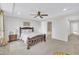 Bright bedroom with natural light, tray ceilings, ceiling fan and ensuite bathroom at 1156 Craigmeade Dr, Morrisville, NC 27560
