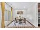 Elegant dining room with round table, stylish chairs, and sliding glass doors to patio at 1156 Craigmeade Dr, Morrisville, NC 27560