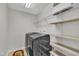 Conveniently located laundry room featuring modern washer and dryer and ample shelving for storage at 1156 Craigmeade Dr, Morrisville, NC 27560