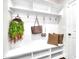 Cozy mudroom with a built-in bench, cubbies, and hooks, perfect for organization at 1156 Craigmeade Dr, Morrisville, NC 27560