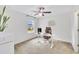 Bright office featuring a ceiling fan, neutral colored walls and carpet, and large window for natural light at 1156 Craigmeade Dr, Morrisville, NC 27560