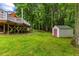 Backyard with a shed for extra storage, set on a well-maintained lawn at 119 Valleycastle Ct, Clayton, NC 27520