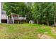A spacious backyard with a large deck and shed, perfect for outdoor activities at 119 Valleycastle Ct, Clayton, NC 27520